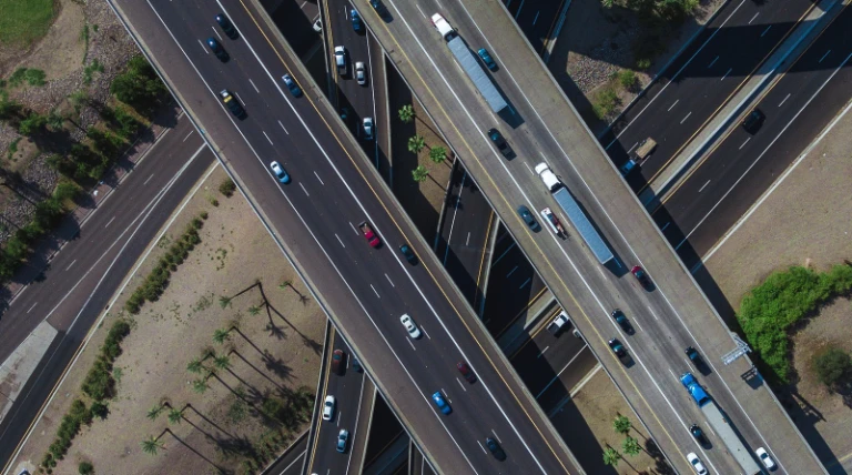 aerial-view-busy-highway-intersection-full-traffic-during-daytime.webp