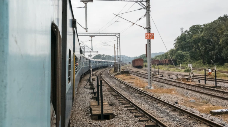 train-passing-railway-station-railroad-background.webp