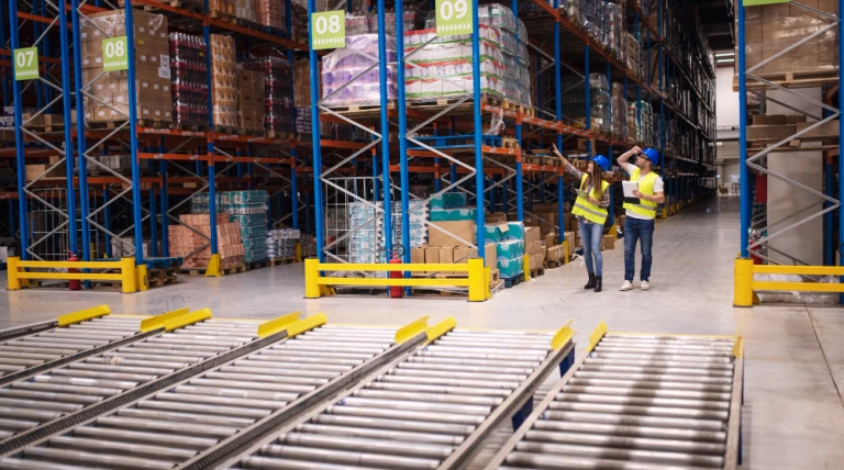 warehouse-workers-checking-inventory-goods-distribution-large-storehouse.webp